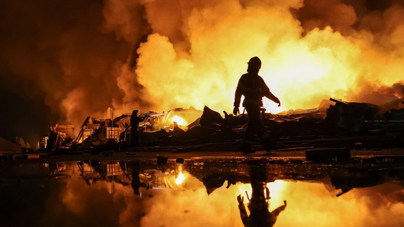 Firefighters working against the fire after a missile attack by Russia in the Kyiv region