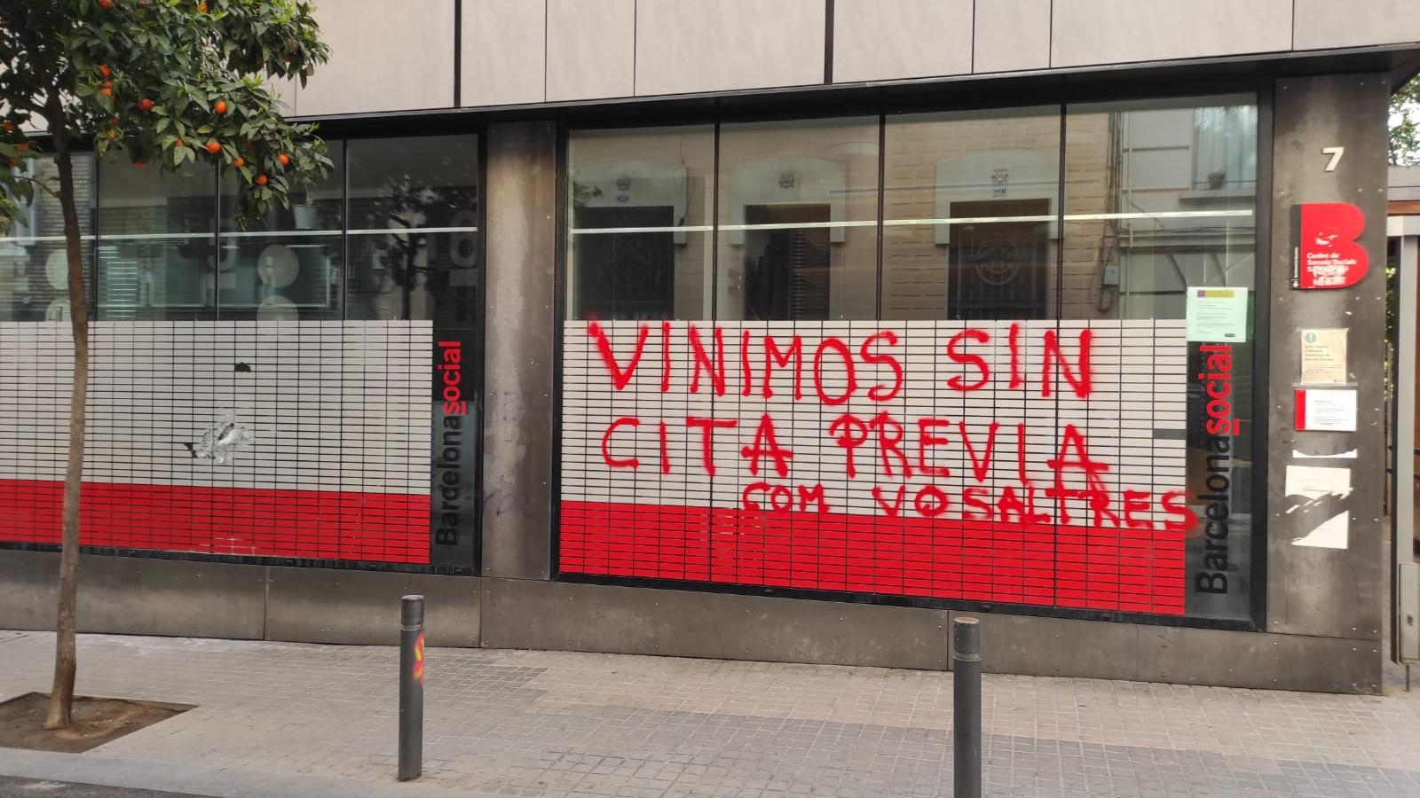 Graffiti on the façade of a Social Services centre in Barcelona