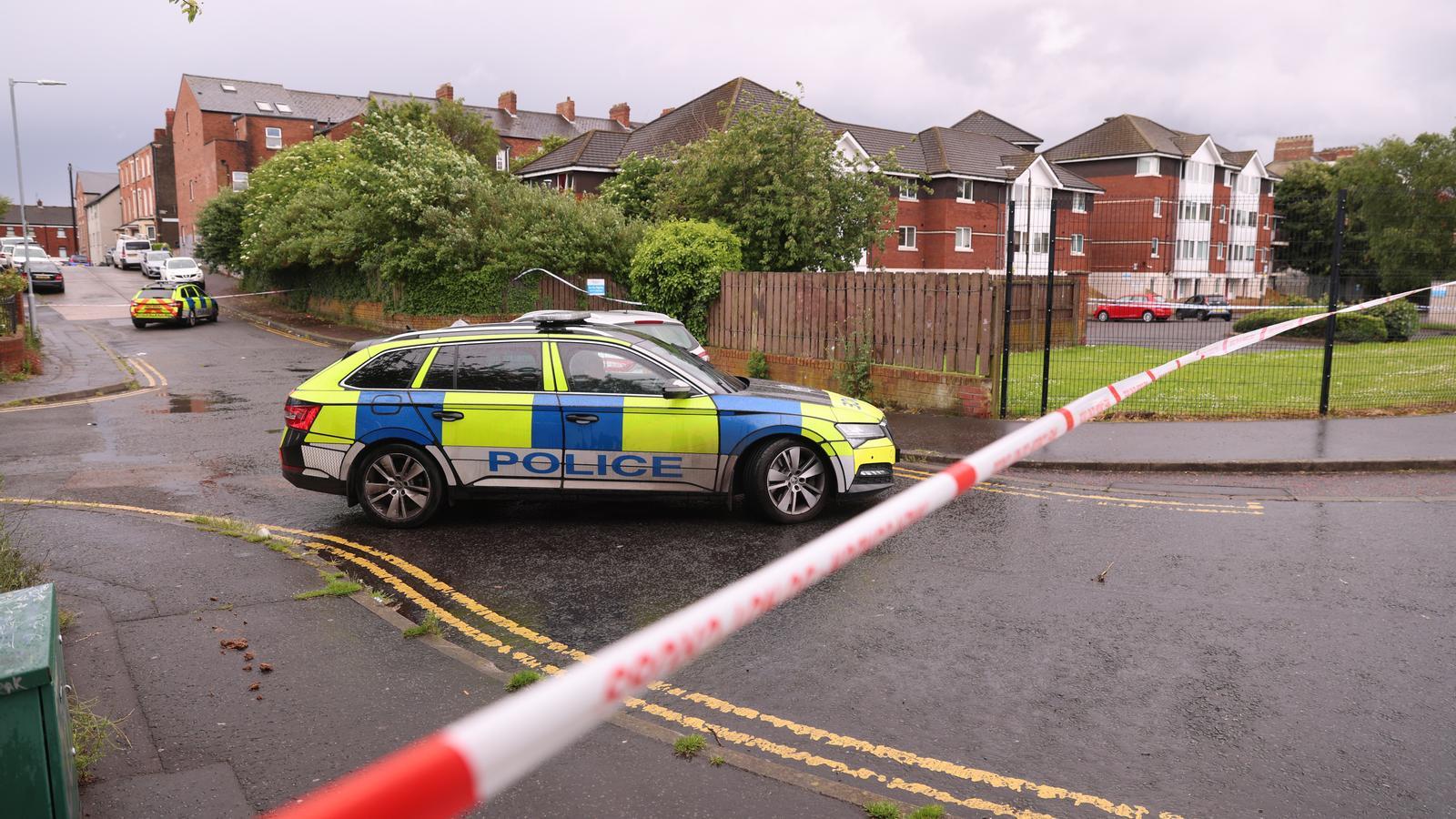 A police cordon is deployed at the scene of the incident, where there was a stabbing in front of some apartments in the Kinnaird Avenue area, north of Belfast.