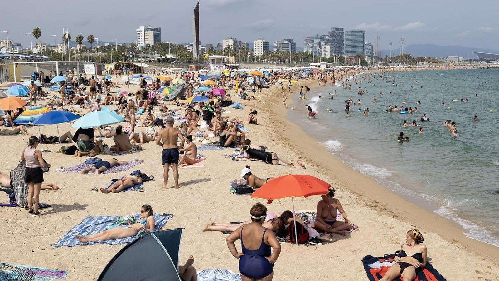 Bathers at Mar Bella beach in Barcelona, on August 6.