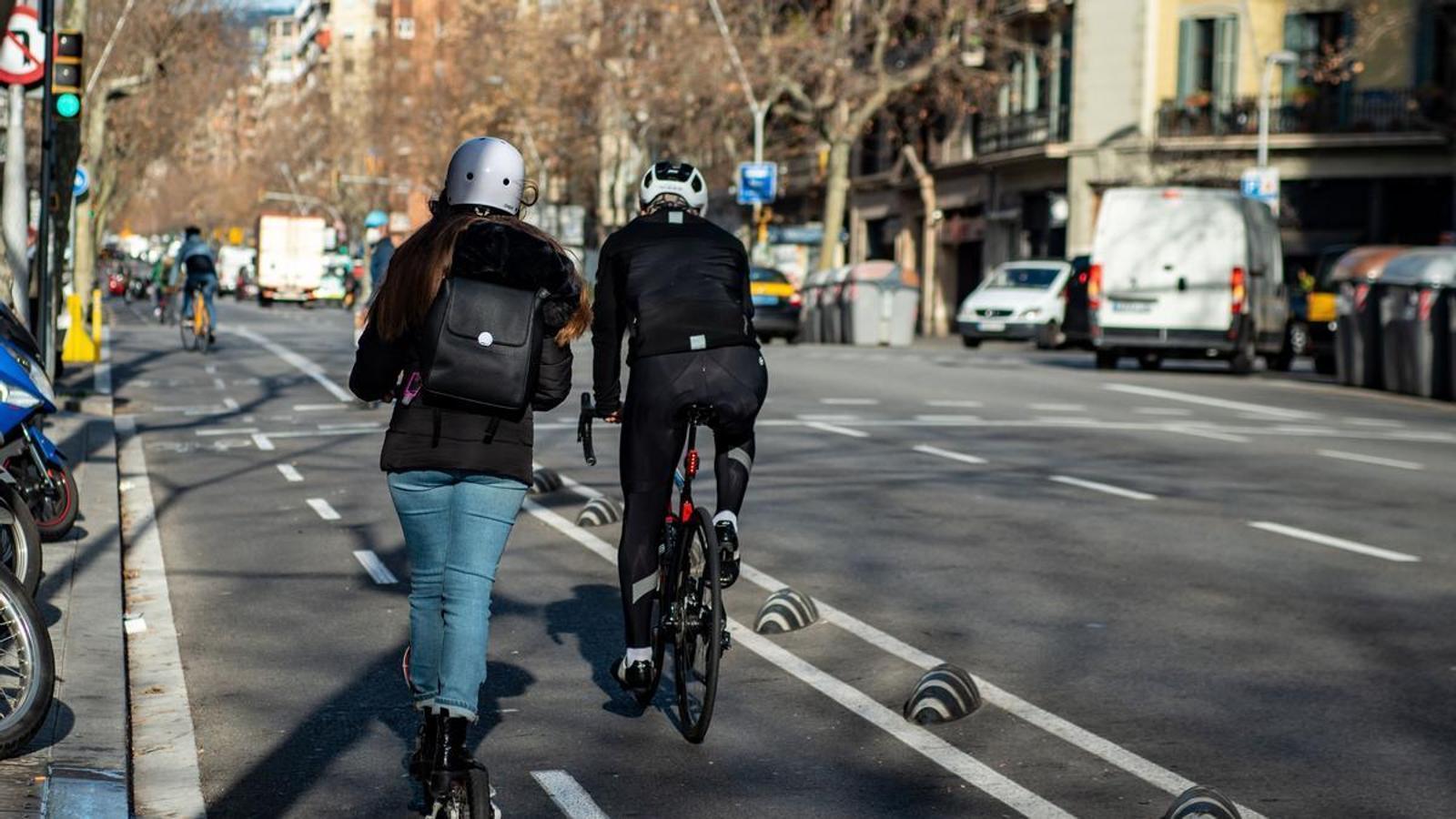 Scooter and bike users with the helmet on.