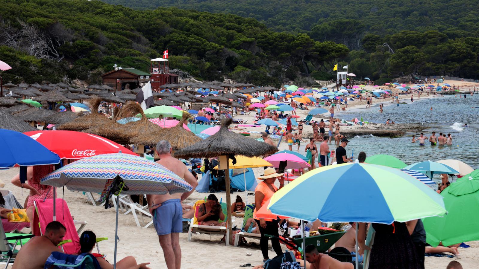 The beach of Cala Agulla, one of so many that are found saturated in the Balearic Islands.