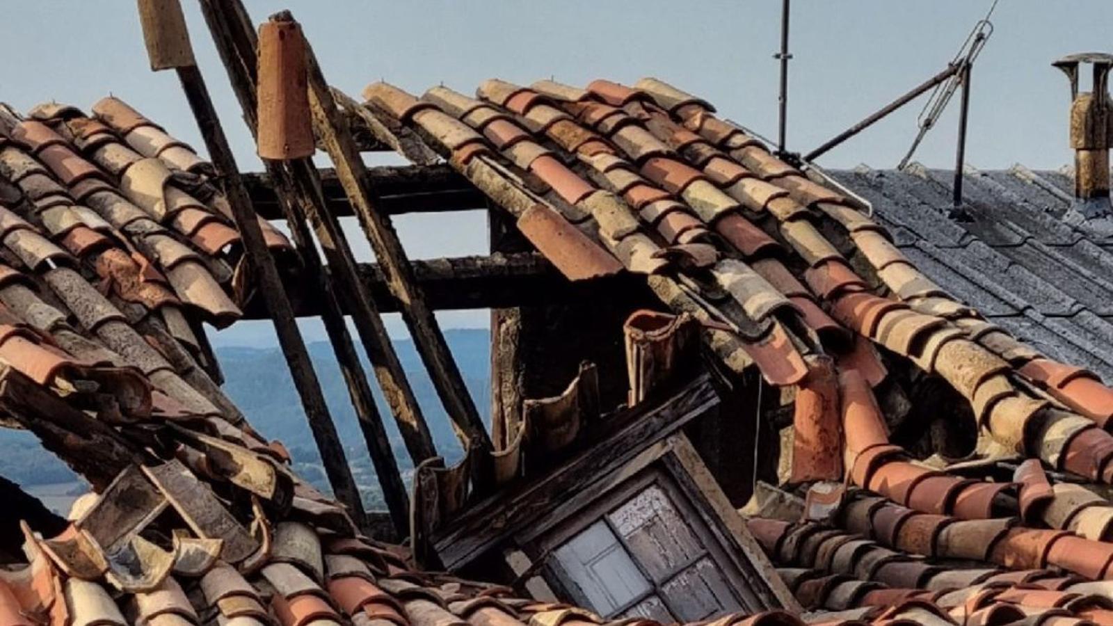 One of the houses where the roof has collapsed