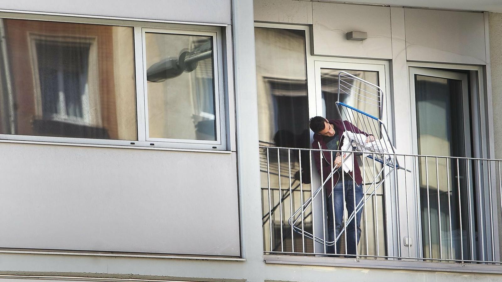 A young man, in a flat in Barcelona