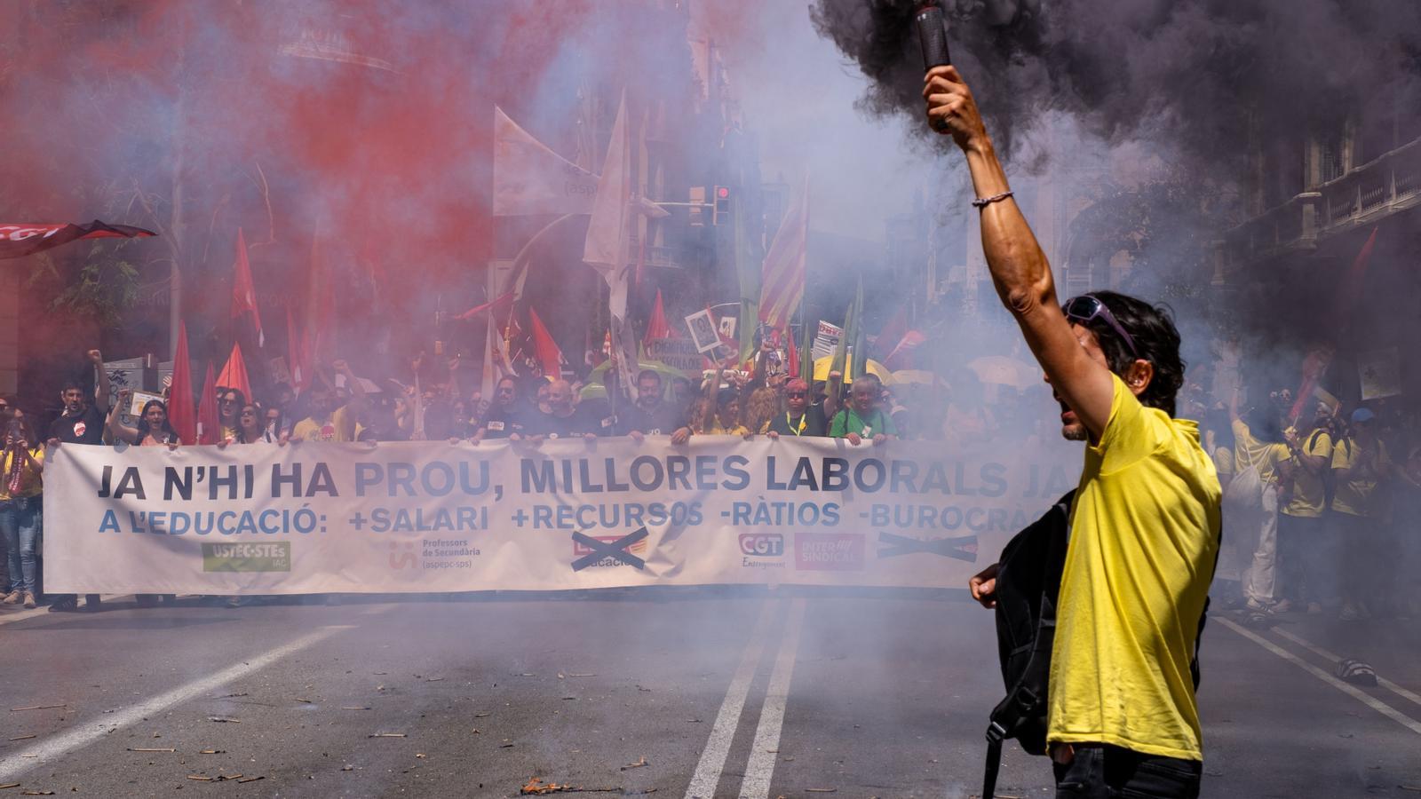 A teacher with a flare at the head of the May 12th demonstration