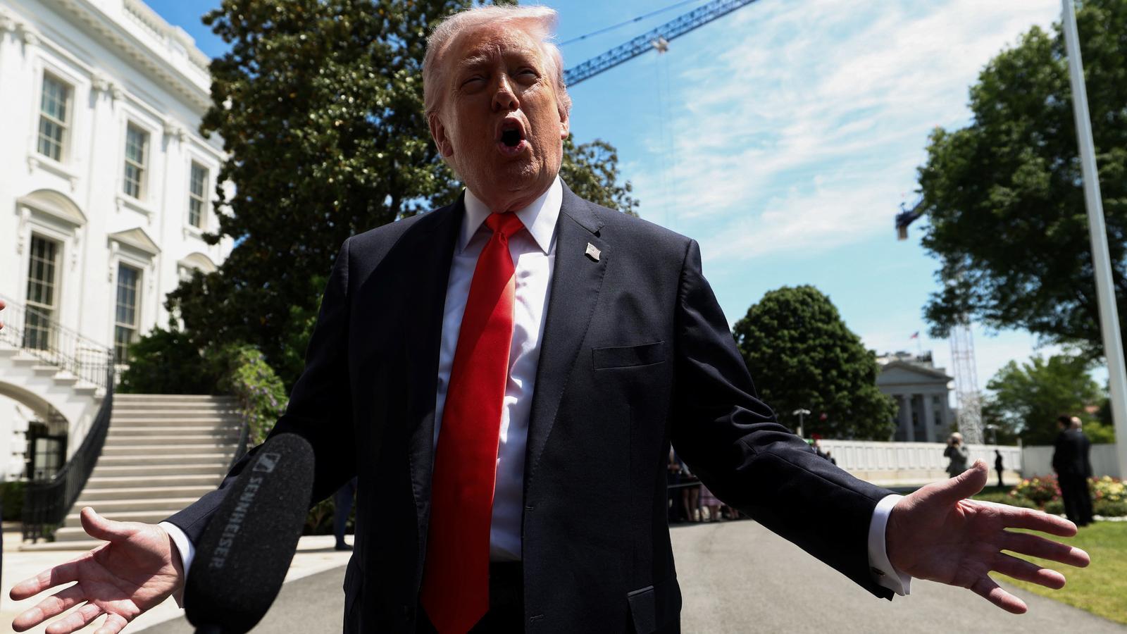 The President of the United States, Donald Trump, addresses the media before marching from the White House.