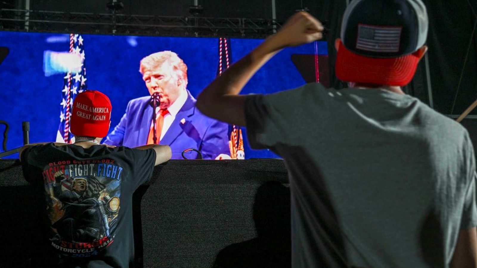 Followers of Donald Trump listen to the president's speech during the celebrations of the 250th anniversary of the United States independence.