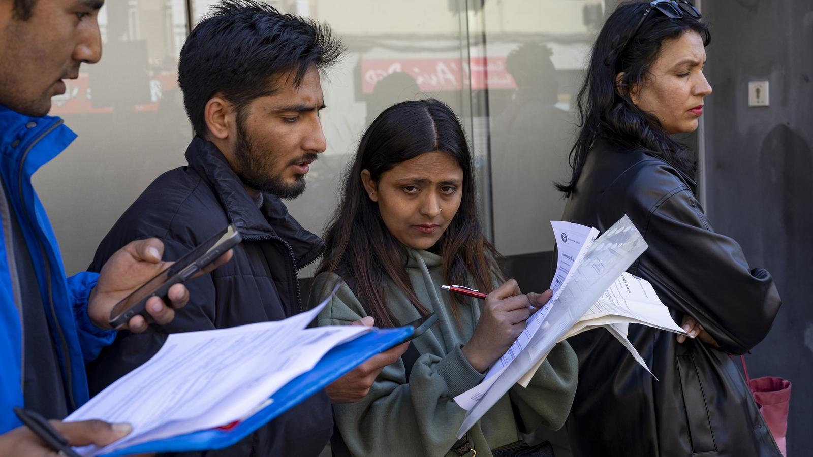 Applicants for regularization waiting for their turn, in a file image.