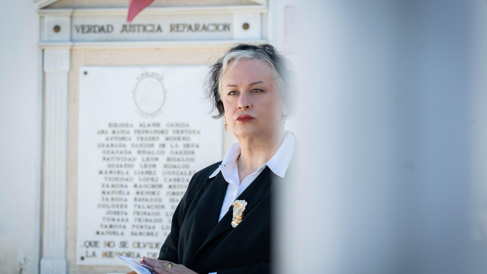 The writer Alana S. Portero, at the Guillena cemetery, in front of where the remains of the seventeen women murdered in 1937 rest