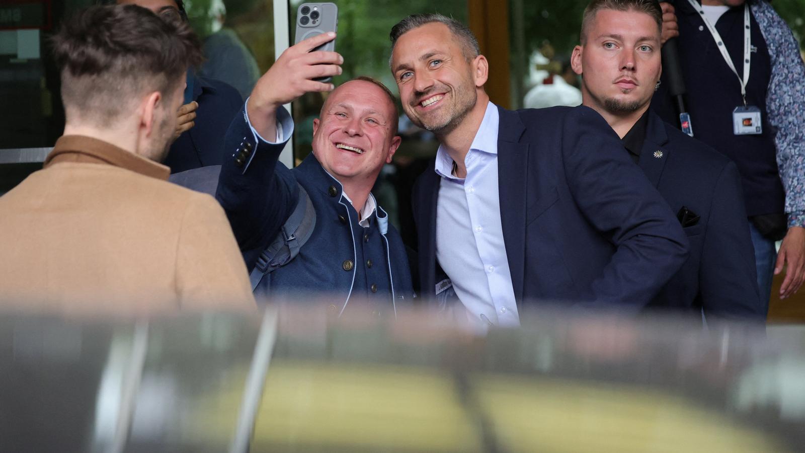 The AfD leader in Saxony-Anhalt, Ulrich Siegmund, with a follower.