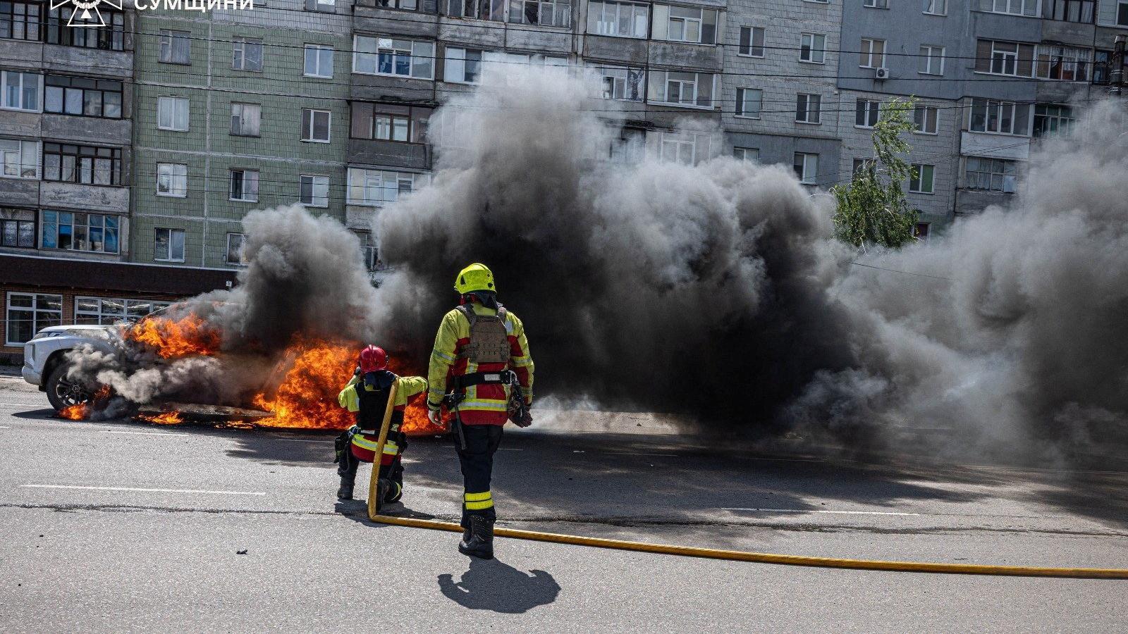 The firefighters try to put out a fire caused by the impact of a Russian projectile in Sumy.
