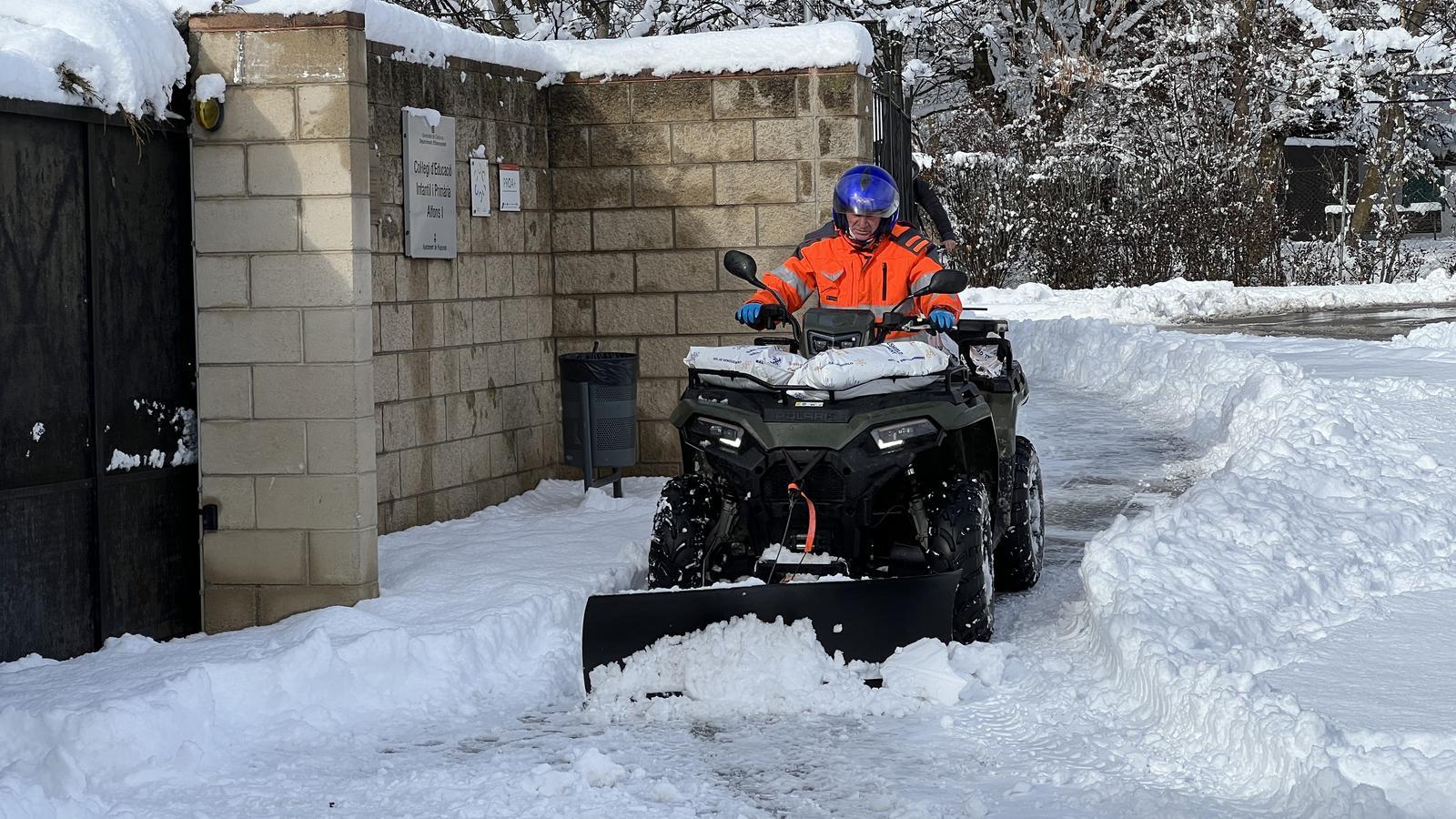 A snowplow removing accumulated snow in Puigcerdà