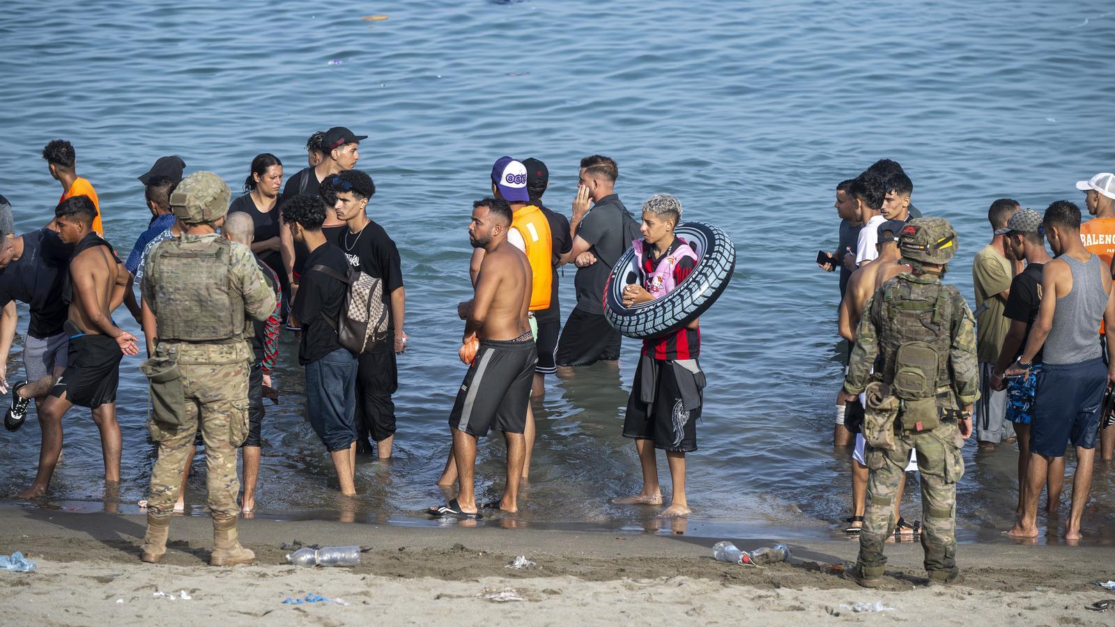 Dozens of migrants try to cross to Ceuta from Morocco on July 31