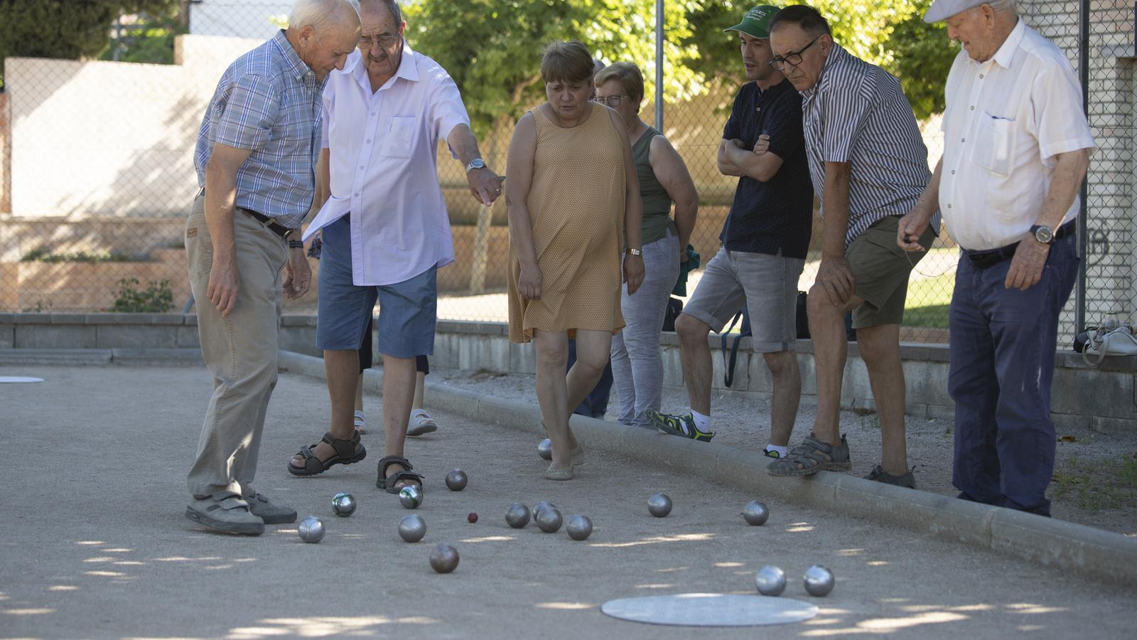Residents of Ascó play petanque in the village.