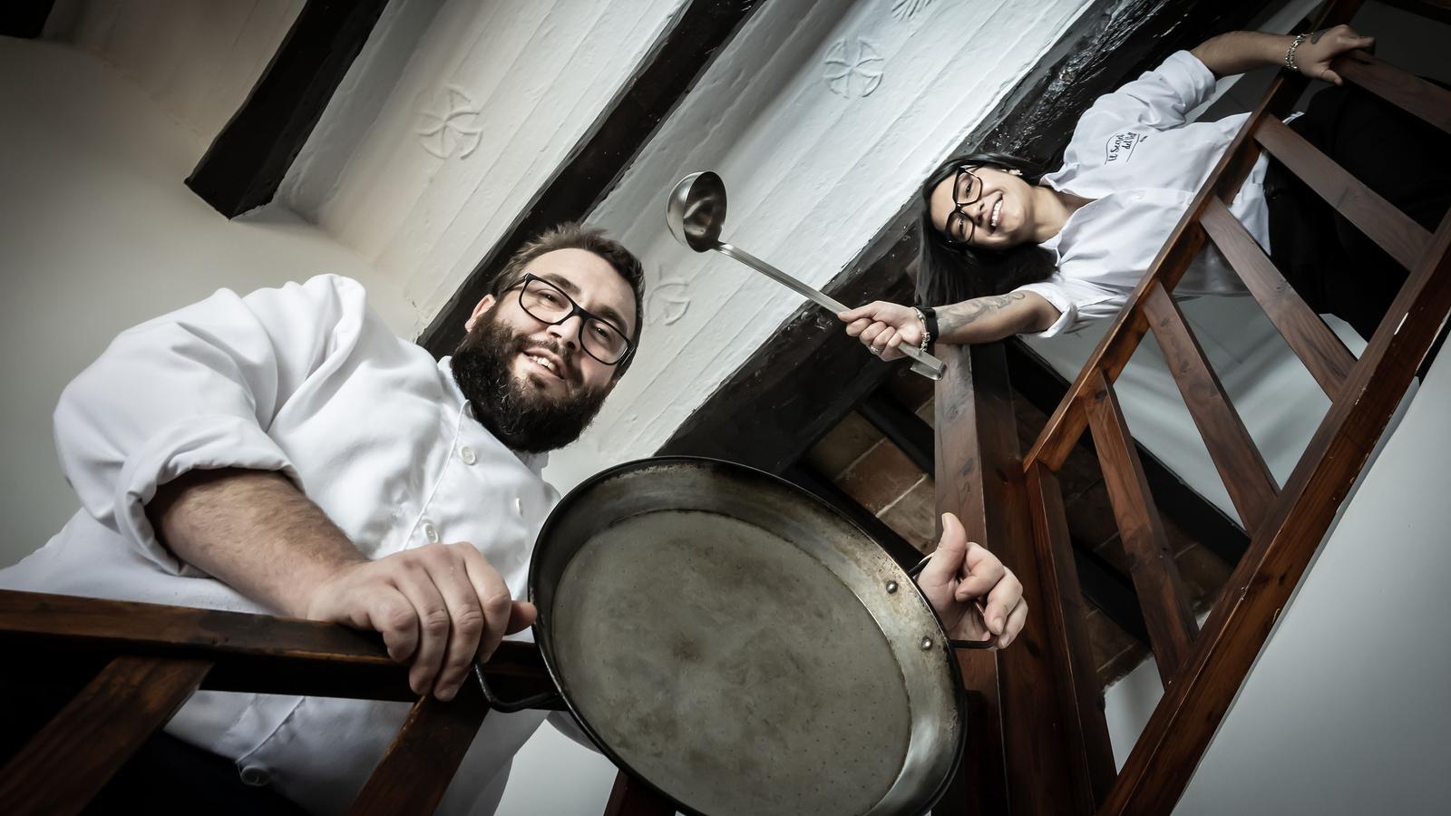 Sergi and Danae on the stairs of El Secret del Vell restaurant.