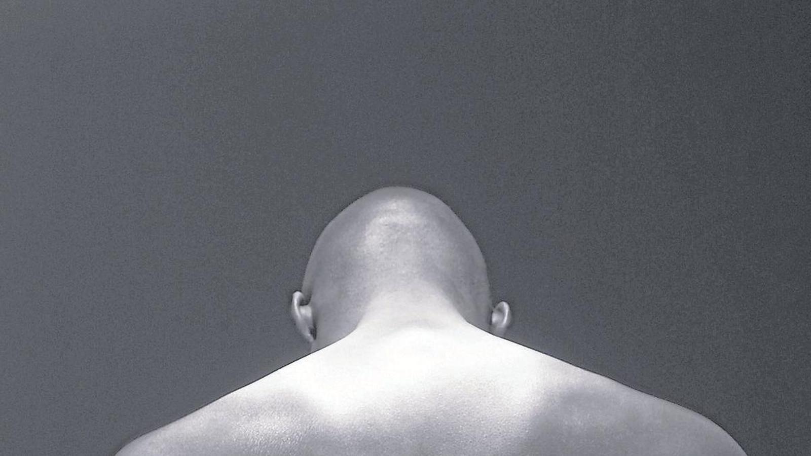 A shaved person in a stock image.