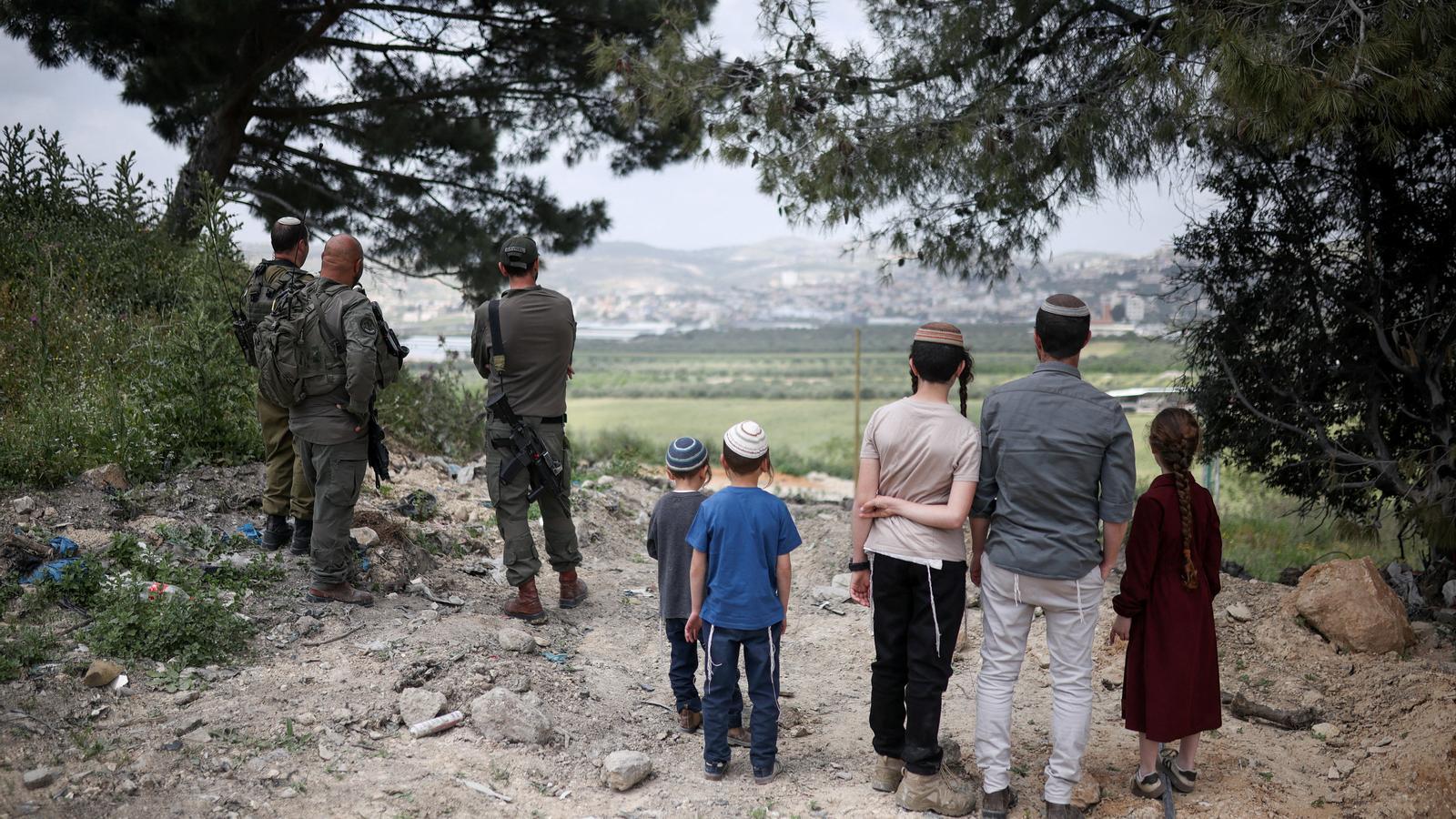 Colonels and Israeli soldiers attend a celebration in the settlement of Sa-Nur, in the occupied West Bank.