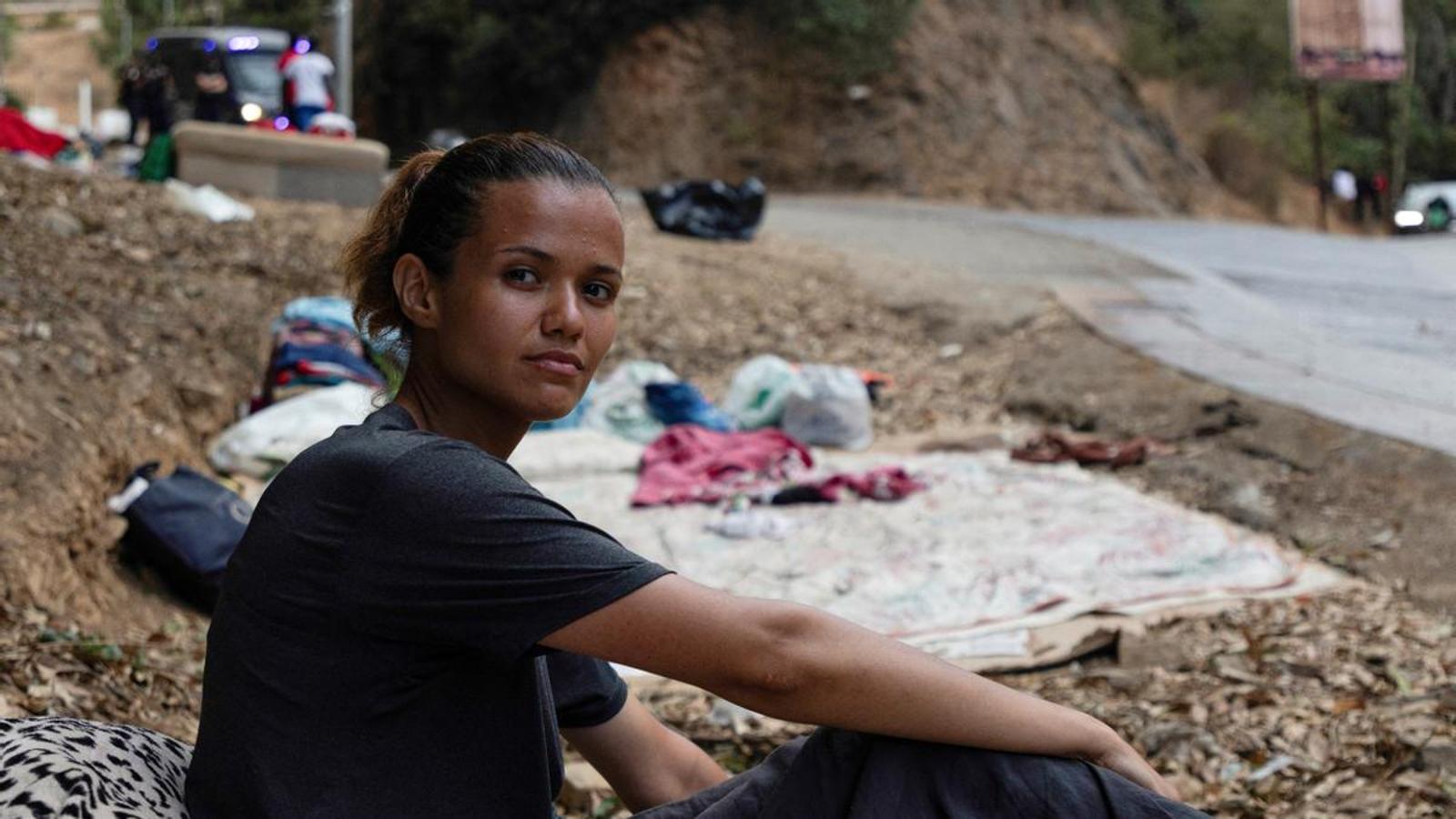 The Moroccan migrant Wafae Atid sits on her inflatable mattress near the Temporary Immigrant Stay Center (CETI) of Ceuta.