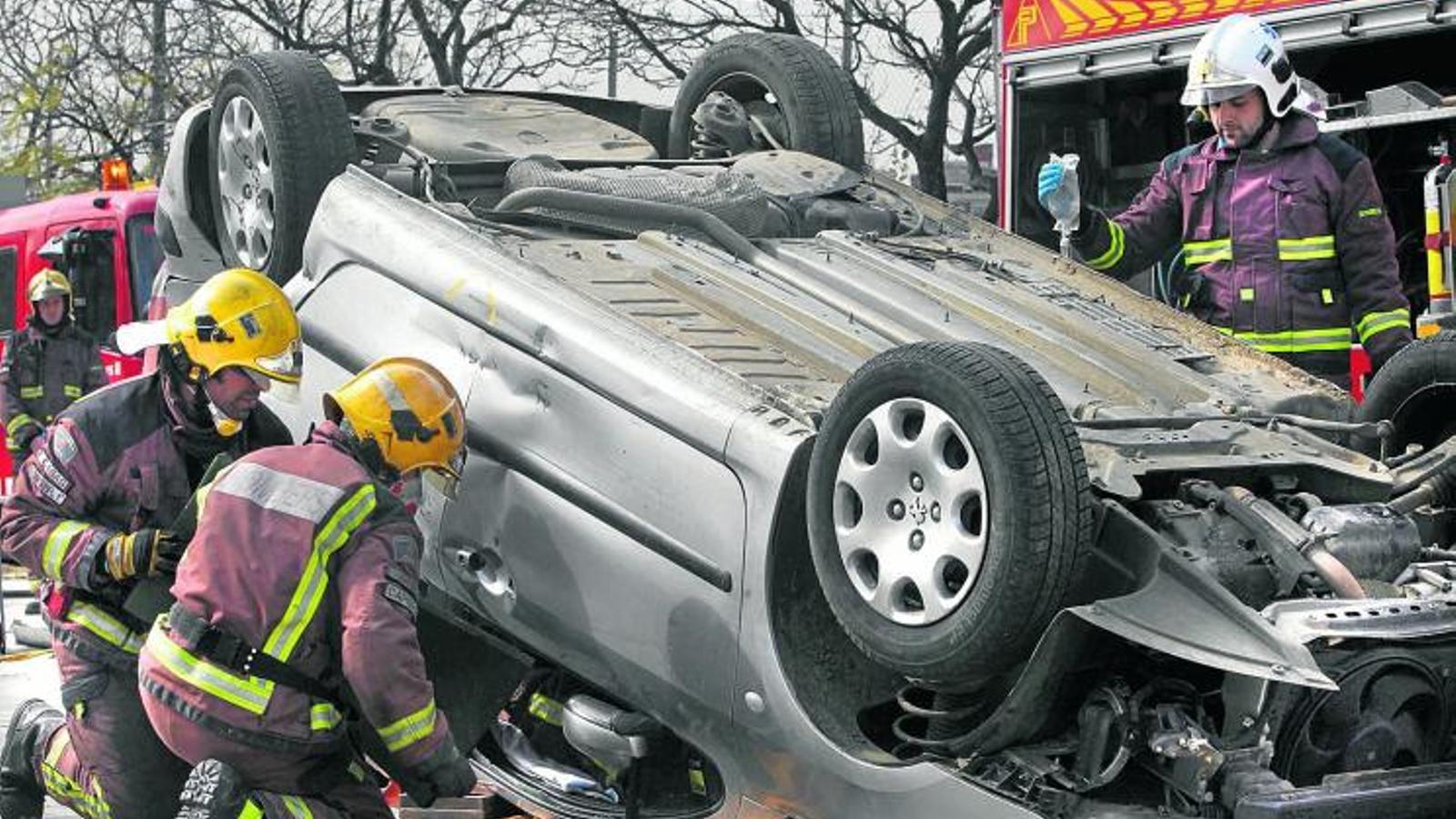 The firefighters during an intervention after a traffic accident.