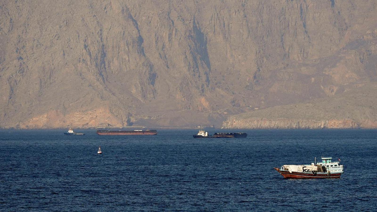 Ships and tankers in the Strait of Hormuz off the coast of Musandam, Oman.