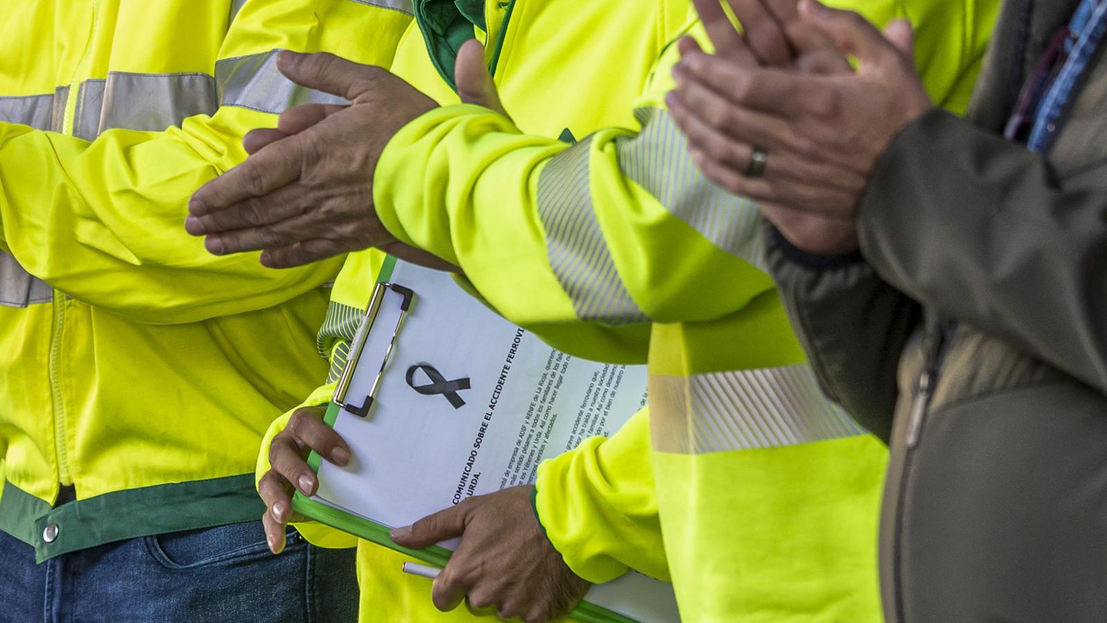 Adif workers holding a minute of silence for the victims of the Urda accident