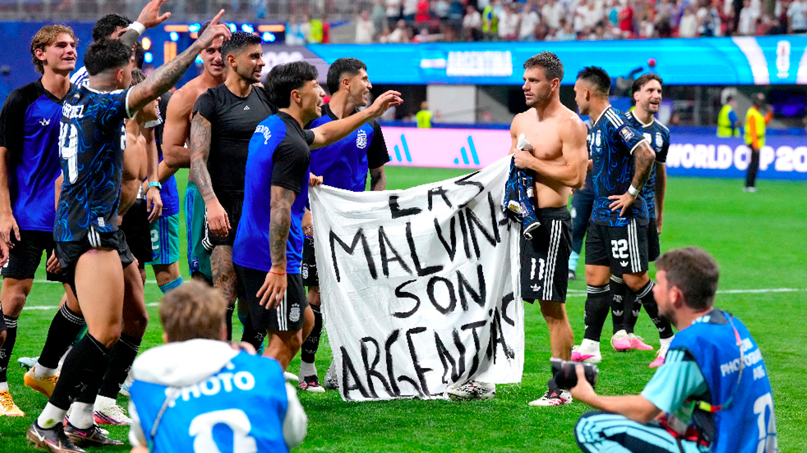 Argentine players with a protest banner about the Falklands after defeating England in the World Cup.