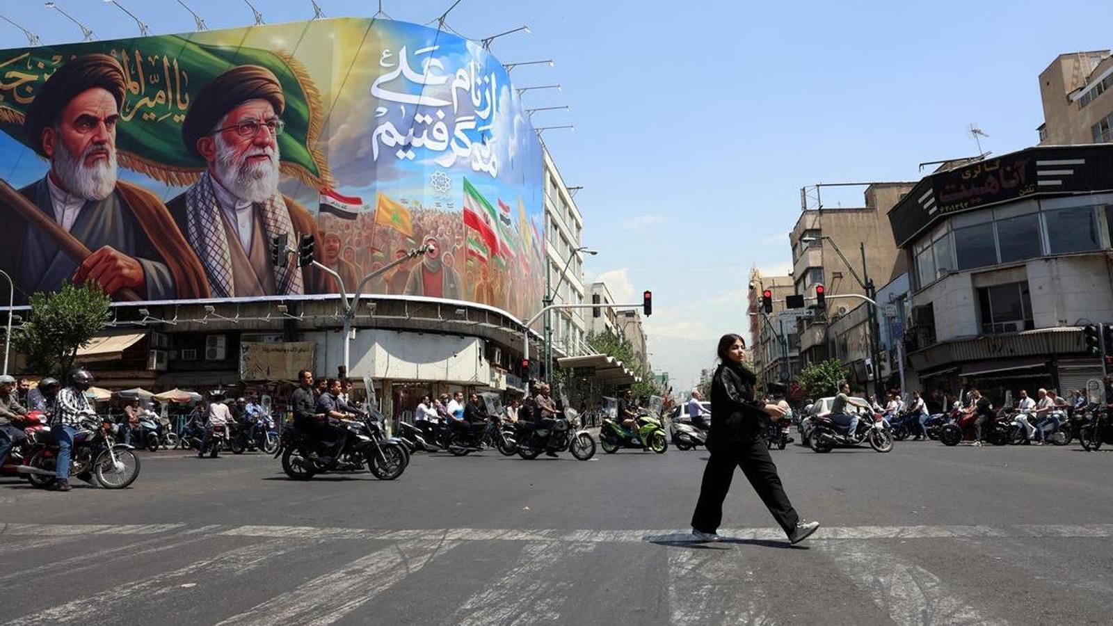 The images of ayatollahs Khomeini and Ali Khamenei, in Tehran, on June 10.