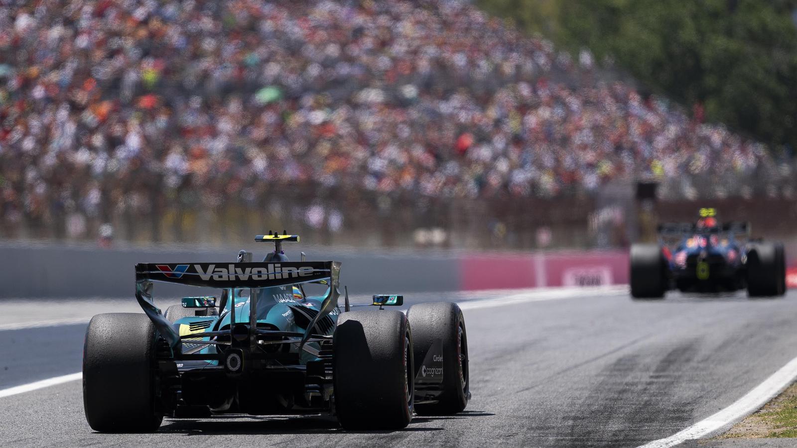 The Aston Martin of Fernando Alonso, exiting the 'pit' at the Barcelona-Catalunya Grand Prix