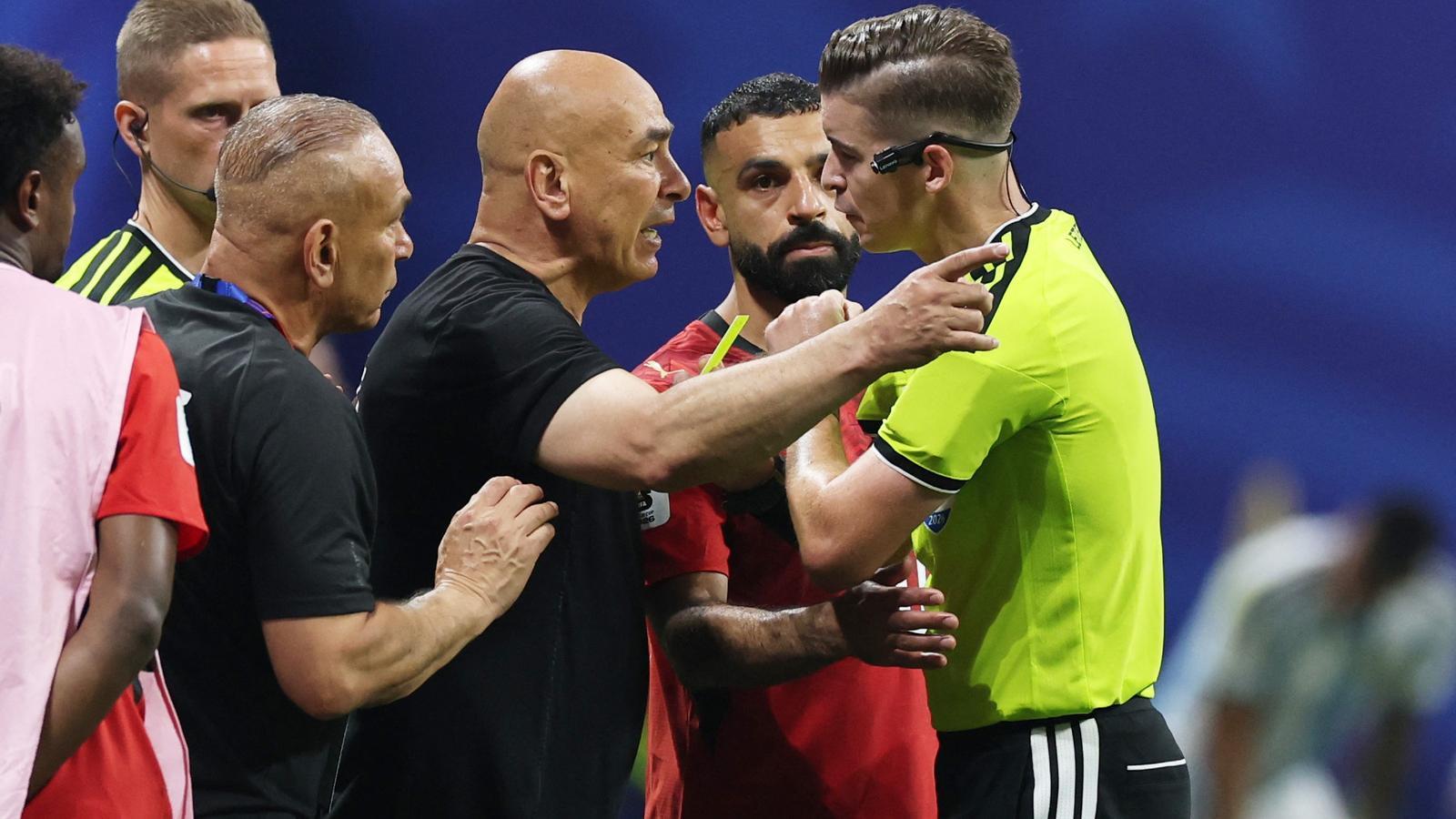 The Egyptian coach, Hassan, protesting a controversial action at Letexier.