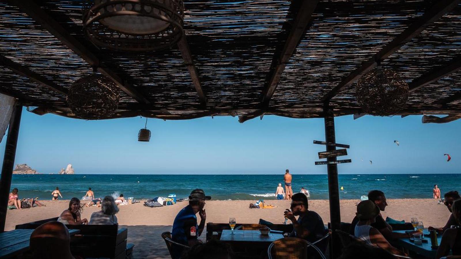 A beach bar on Estartit beach, with the Medes Islands in the background.