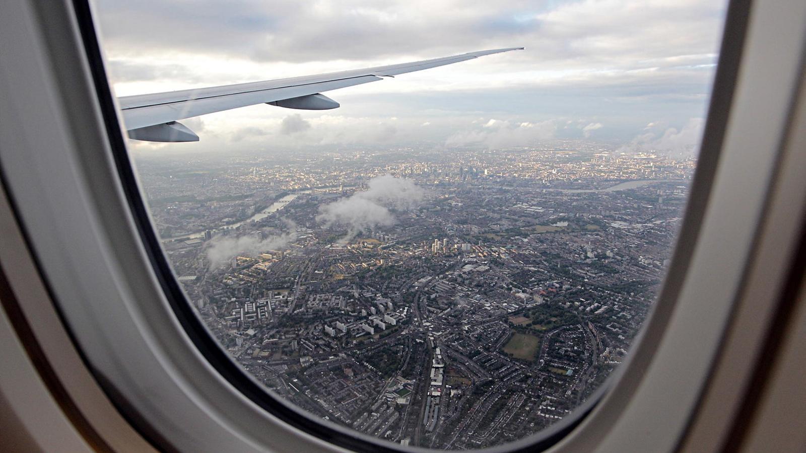 A city seen from the window of a commercial airplane.
