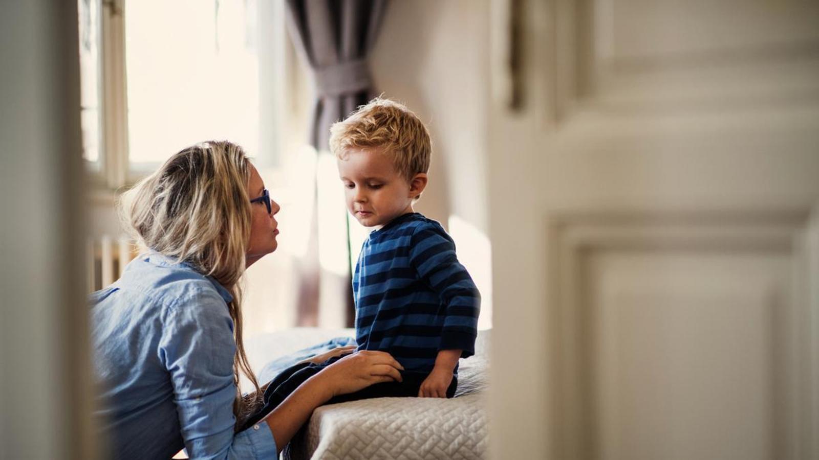 The mother speaks with her small son.