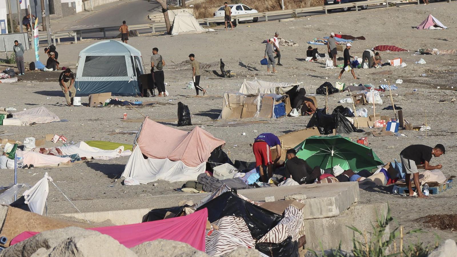 Immigrants camped on El Trampolín beach in Ceuta.