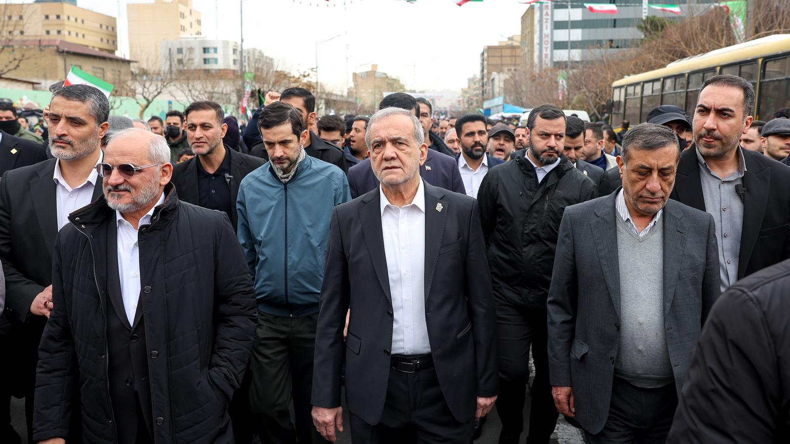 President Masoud Pezeshkian, in the center, with his son Yousef Pezeshkian, in a blue jacket, in Tehran last month, before the war began.