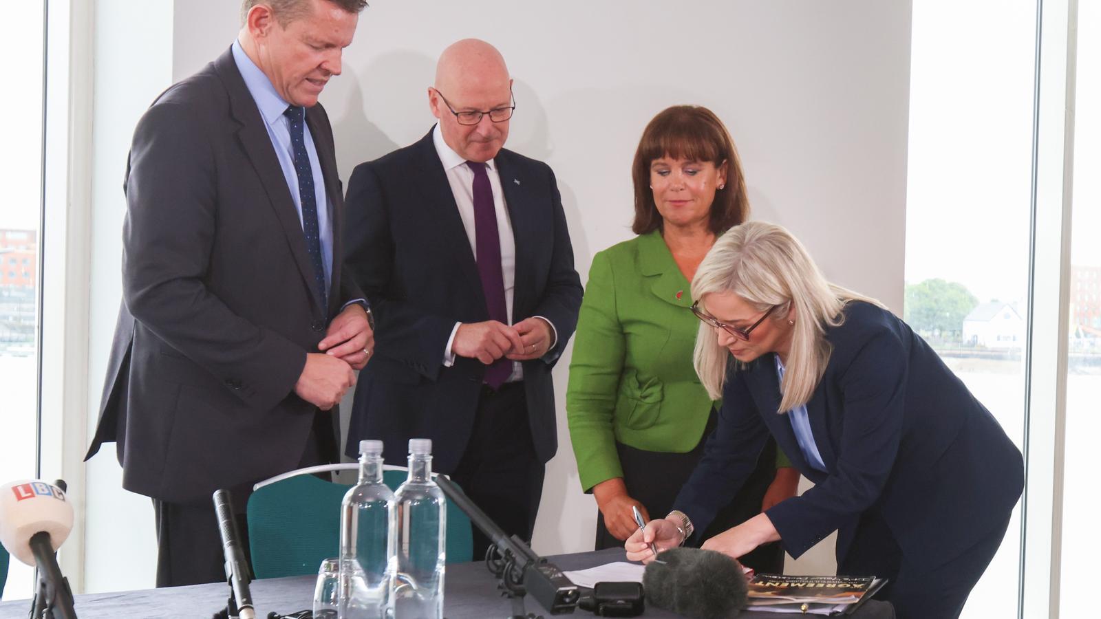 The First Minister of Wales, Rhun ap Iorwerth, the one of Scotland, John Swinney, the president of Sinn Féin, Mary Lou McDonald, and the First Minister of Northern Ireland, Michelle O'Neill, sign the joint declaration in Cardiff, Wales.