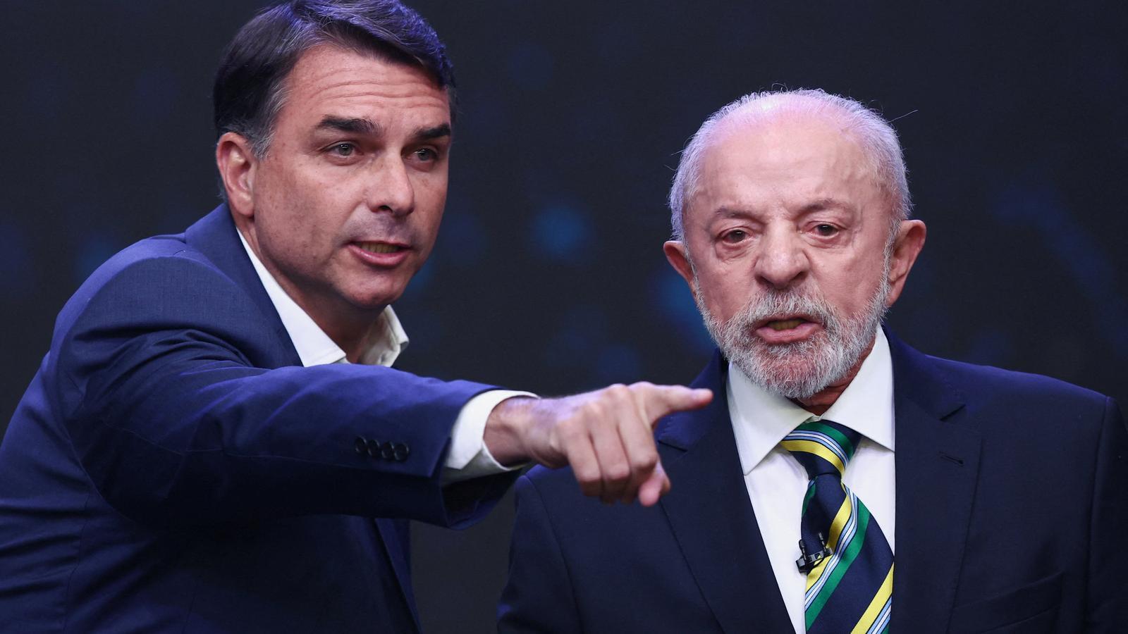 Flávio Bolsonaro and Lula da Silva in an electoral debate before the second round of the presidential elections.