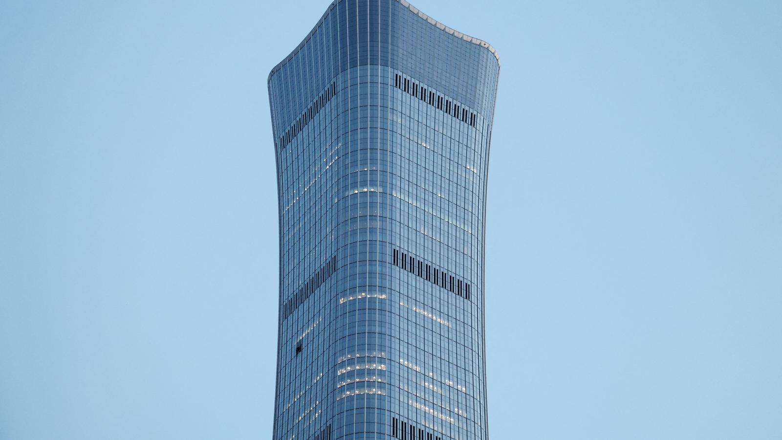 The China Zun building in Beijing, damaged after a small plane crashed into it.