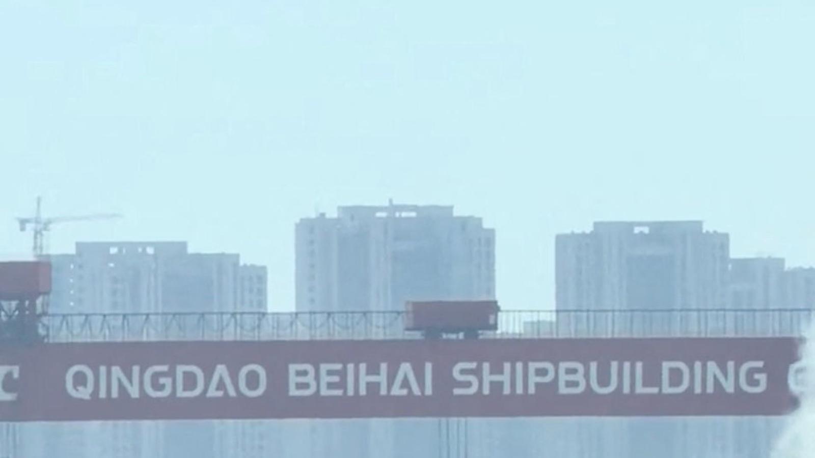 The cargo ship set on fire at the port of Tsingtao, in China