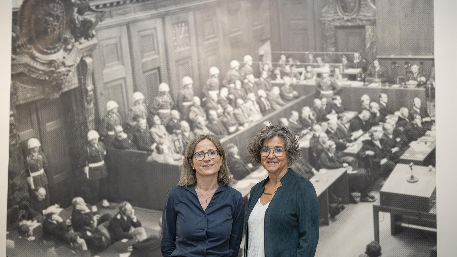 Waltraud Hofer and Emma Soler with one of the photos from the Nuremberg trial that can be seen at the exhibition