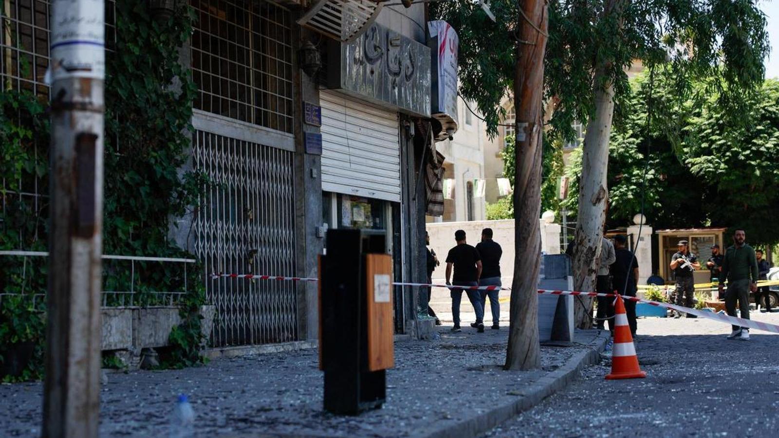 Broken glass and other debris from Tuesday's explosions in Damascus, which took place near the hotel where Emmanuel Macron was staying.