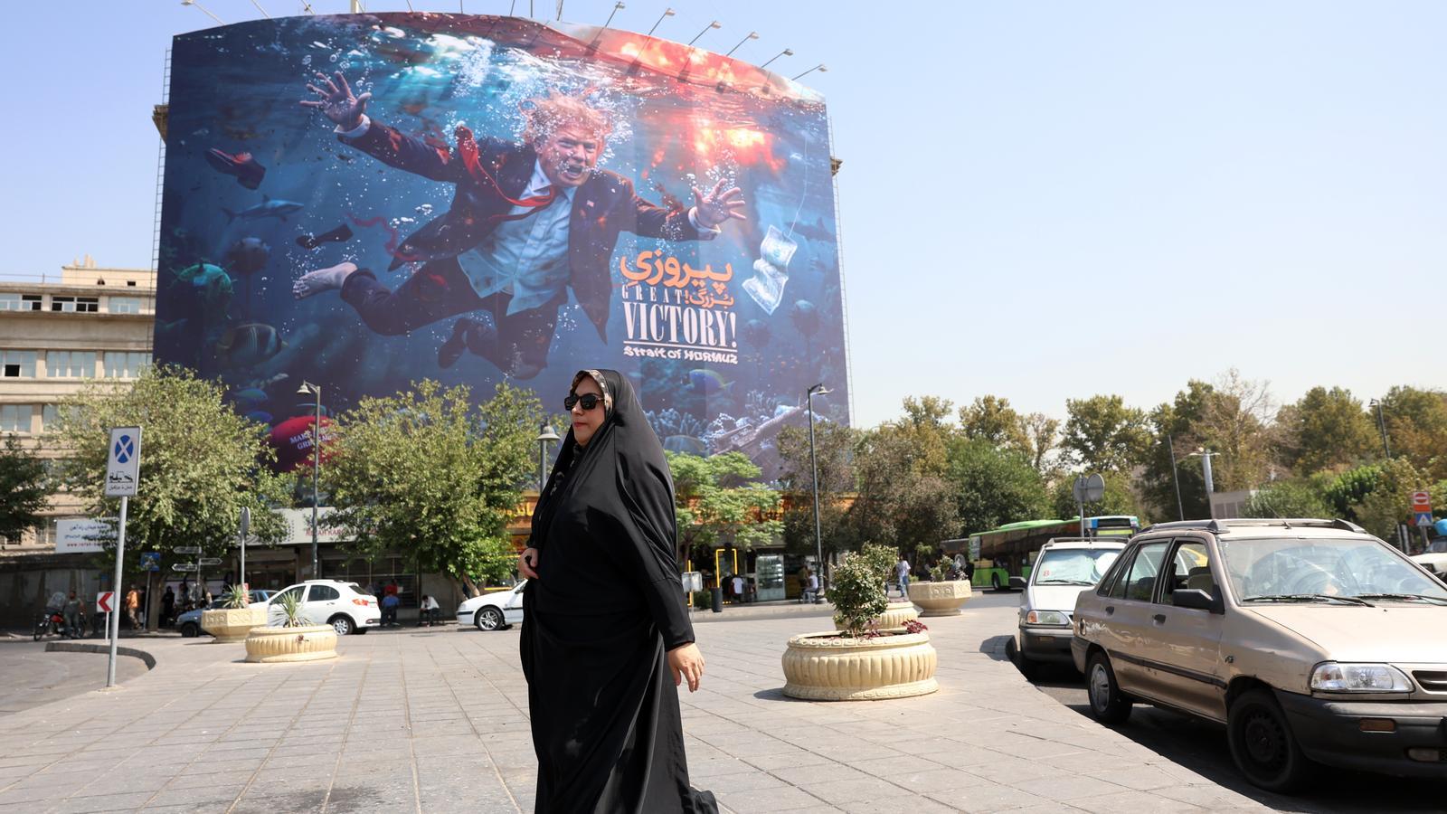 A poster alluding to the situation of the President of the United States, Donald Trump, following the difficulties for oil and gas to circulate through the Strait of Hormuz, in Tehran
