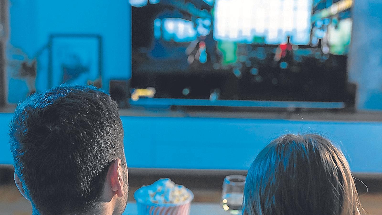 A couple watching television