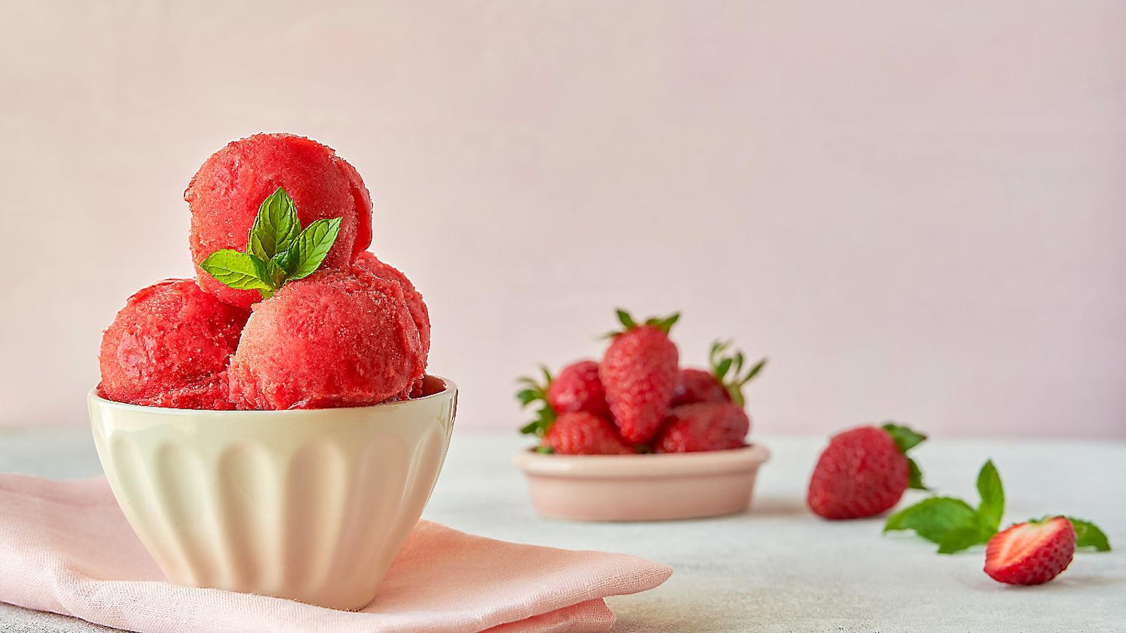 01. Scoops of vegan strawberry ice cream. 02. A tub of Amma Gelato.