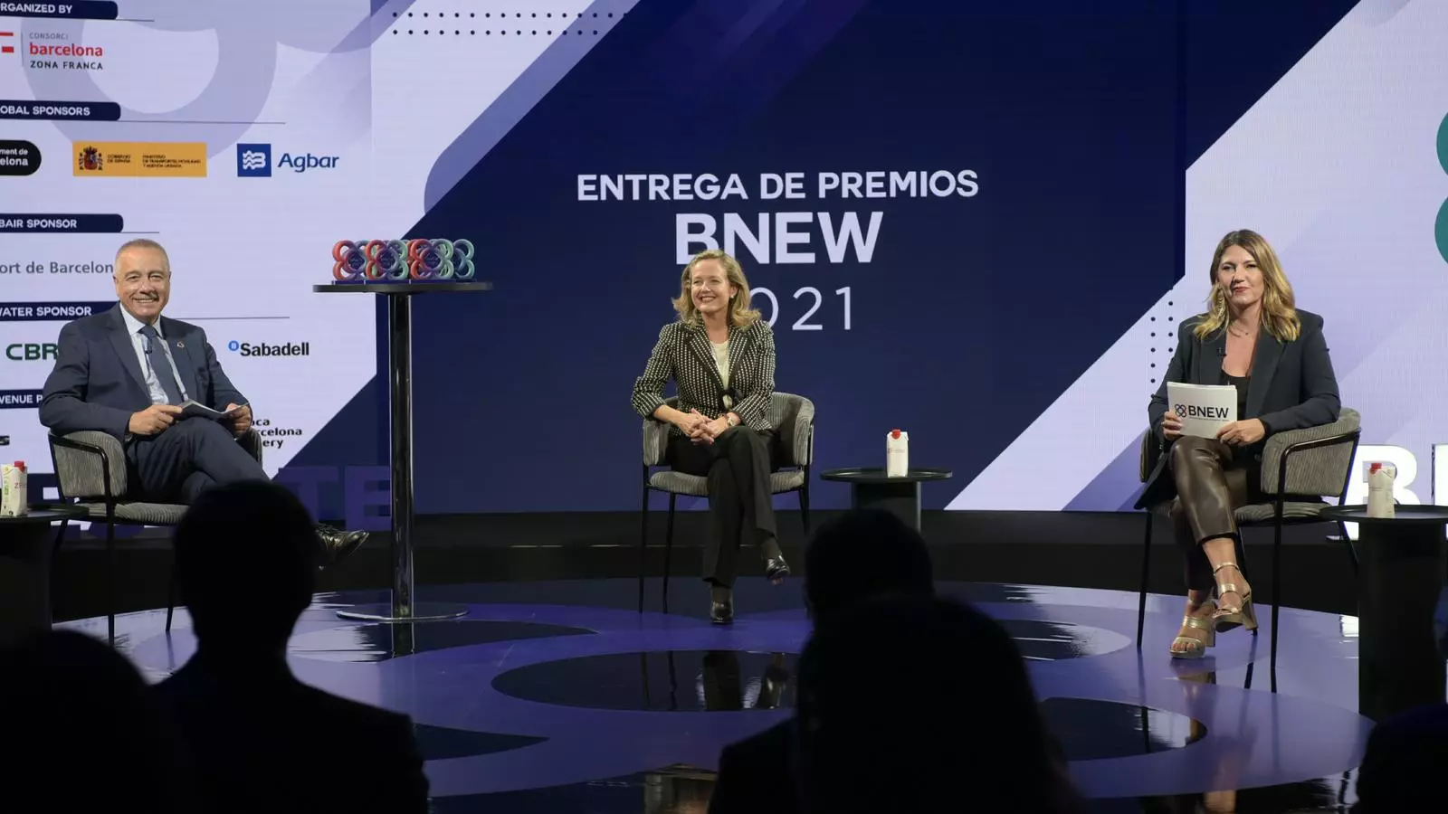EL delegat especial de l'Estat al CZFB, Pere Navarro, la ministra Nadia Calviño i Blanca Sorigué, directora general del CZFB i del BNEW, en l’edició de l’any passat