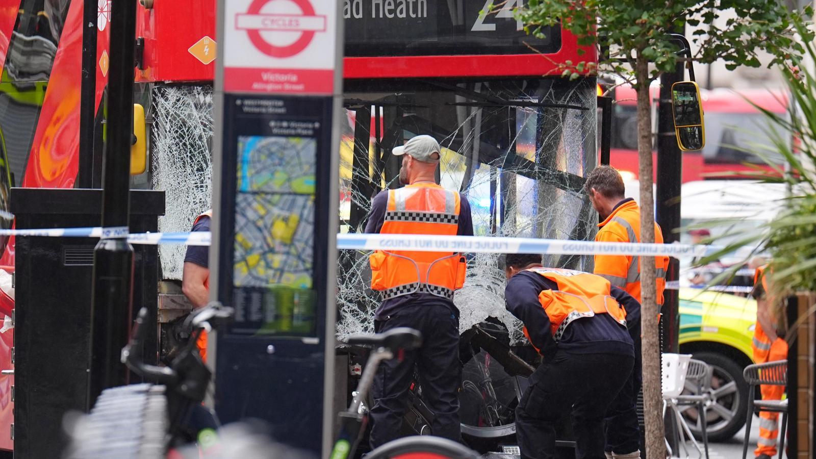 Emergency services at the scene on Allington Street in central London following a collision involving a double-decker bus.
