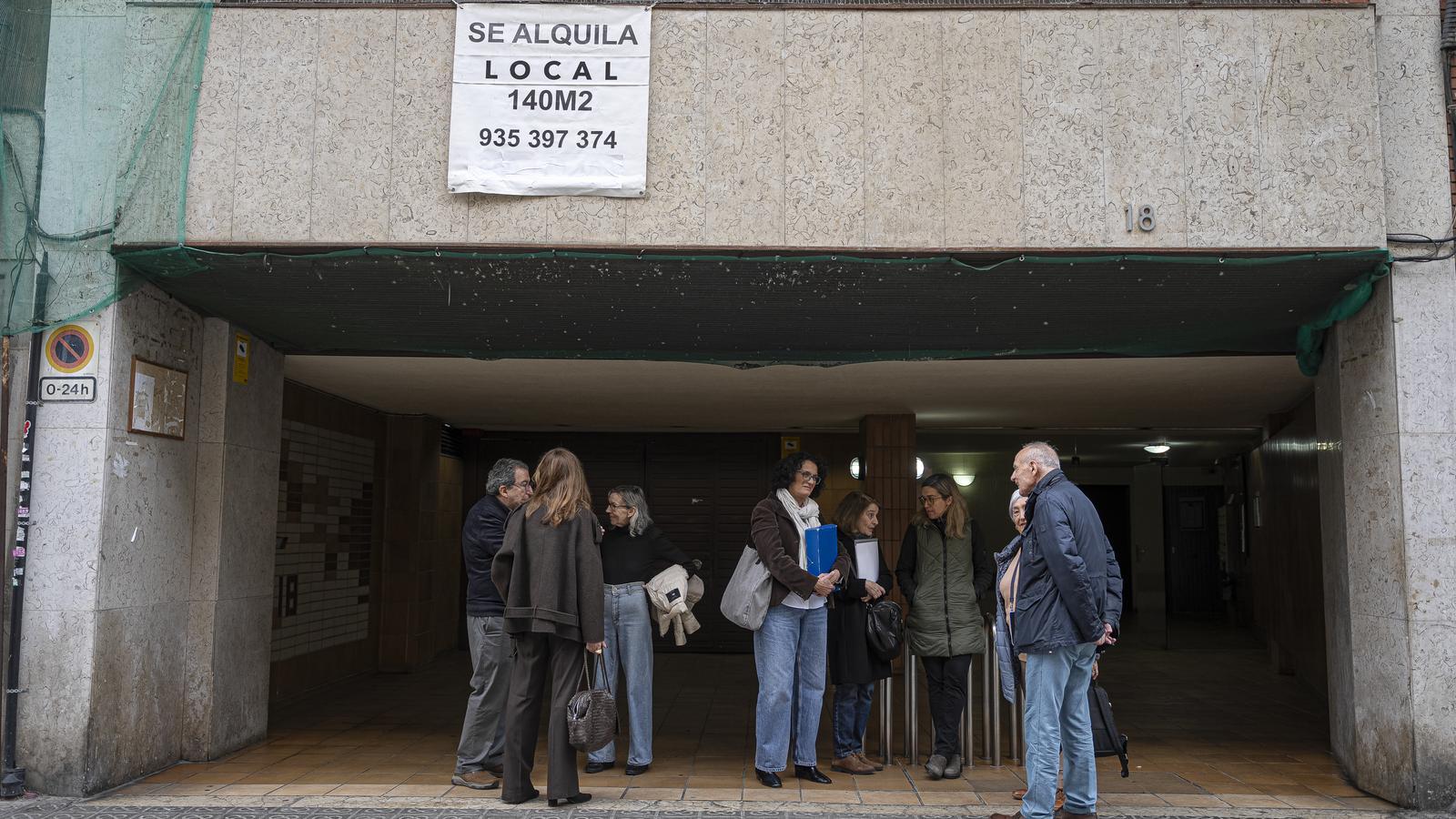 A group of the affected neighbors at the entrance of the building