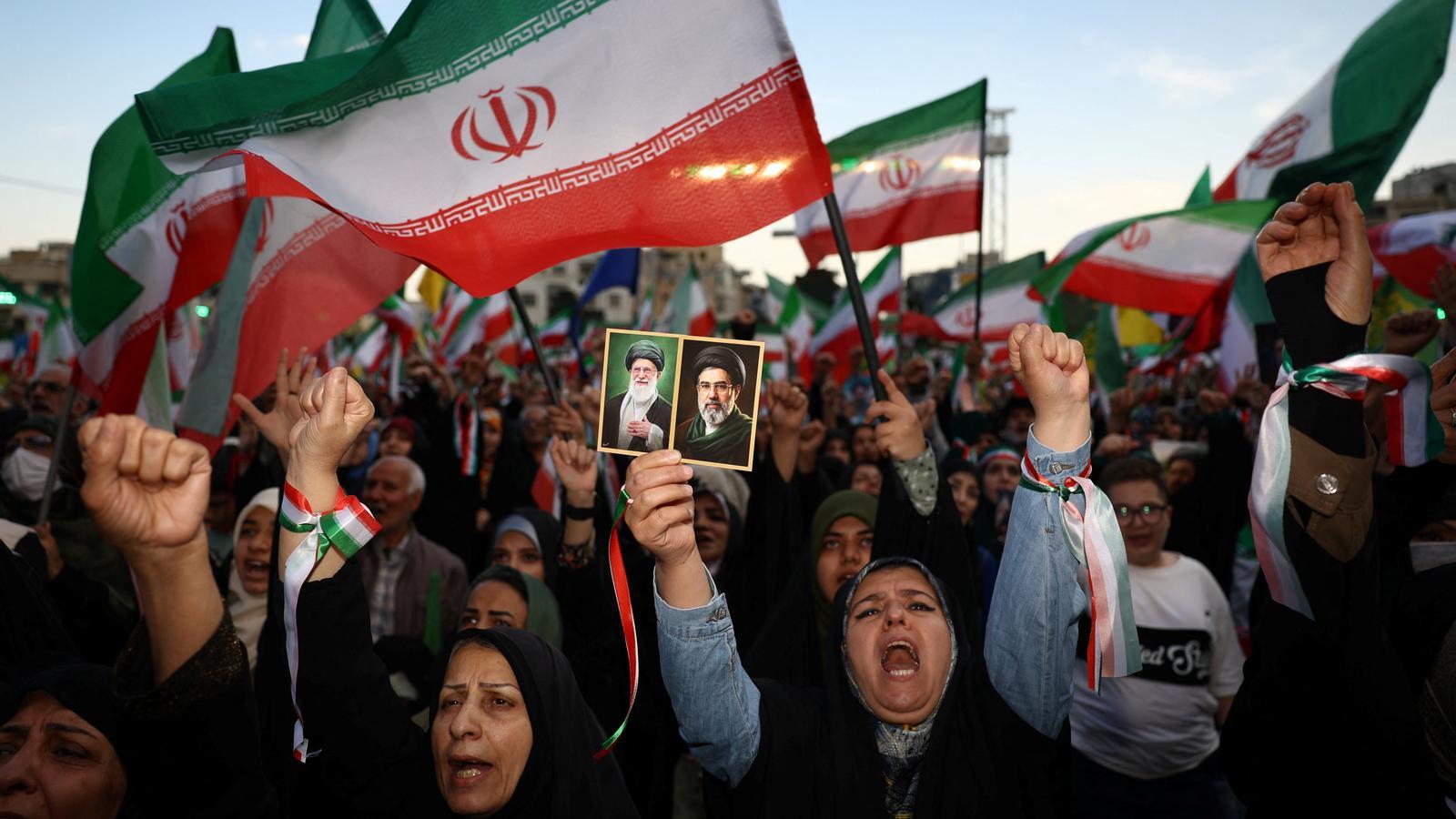 People singing during a demonstration in Tehran