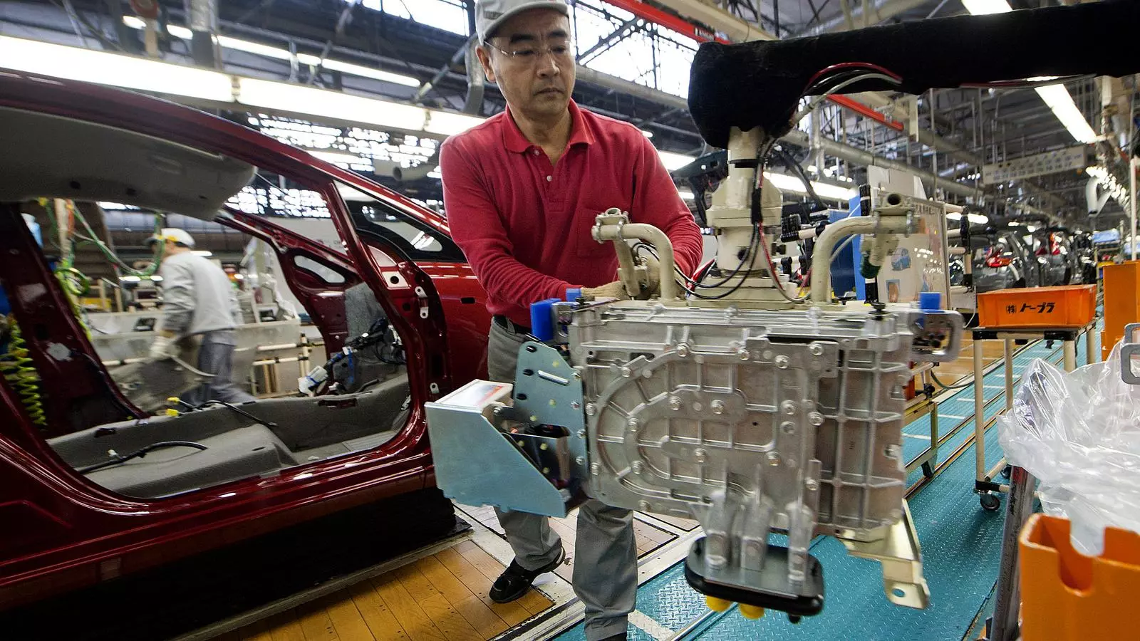 Nissan Motor Corporation employees assemble electric cars at the Oppama factory