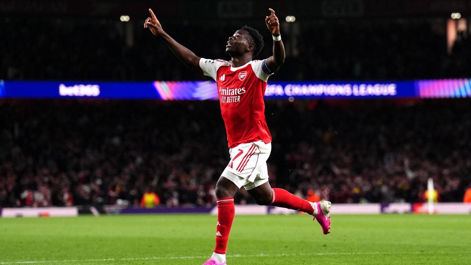 Bukayo Saka celebrates the goal that qualifies Arsenal for the Champions League final