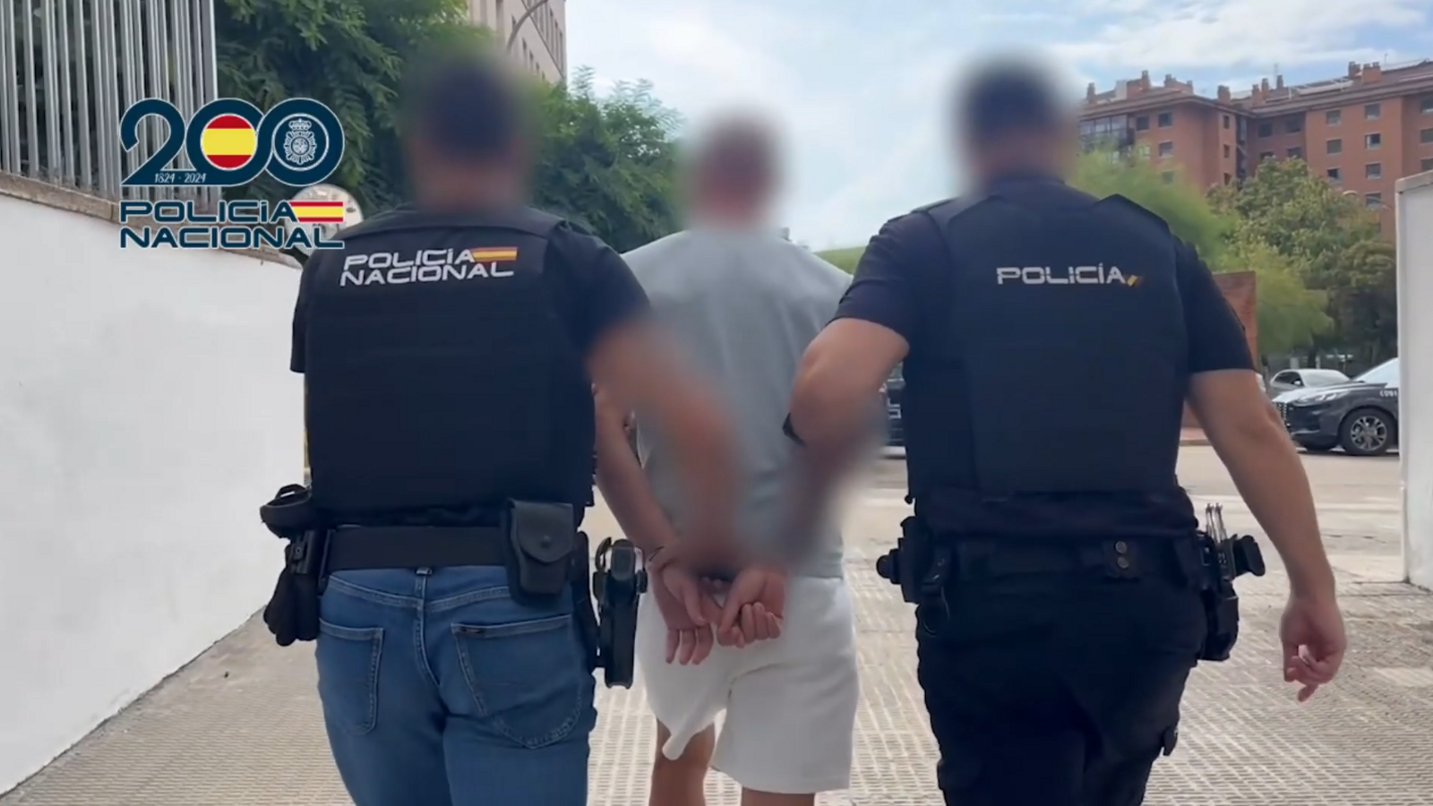Images of the detainee accompanied by Spanish police officers in Tarragona.